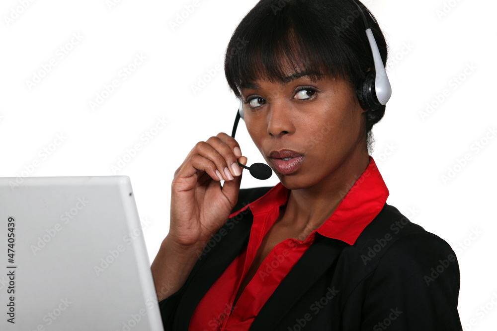 Afro-American businesswoman with headset on her head Afro-American businesswoman with headset on her head