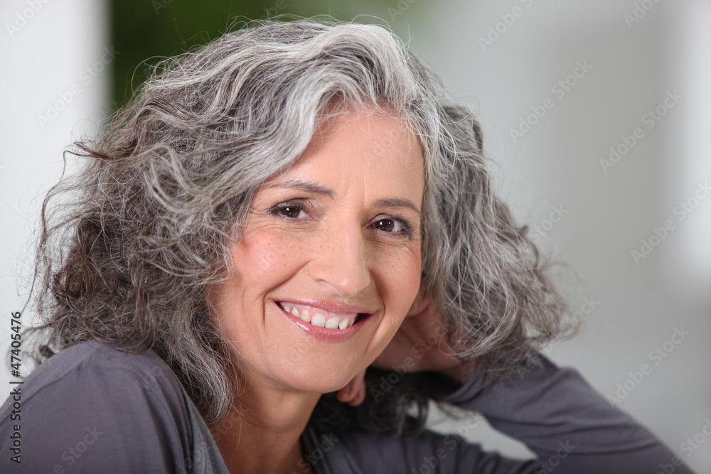 Close-up of grey haired woman at home Close-up of grey haired woman at home