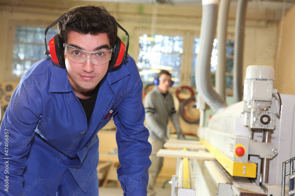 apprentice working in a factory