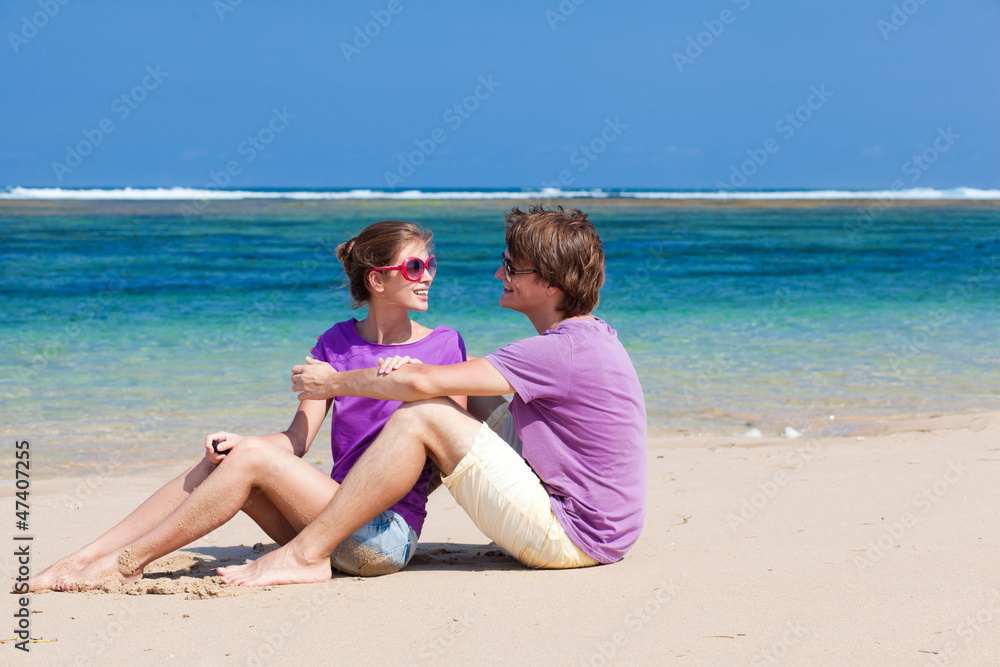 young beautiful couple on tropical bali beach.honeymoon young beautiful couple on tropical bali beach.honeymoon