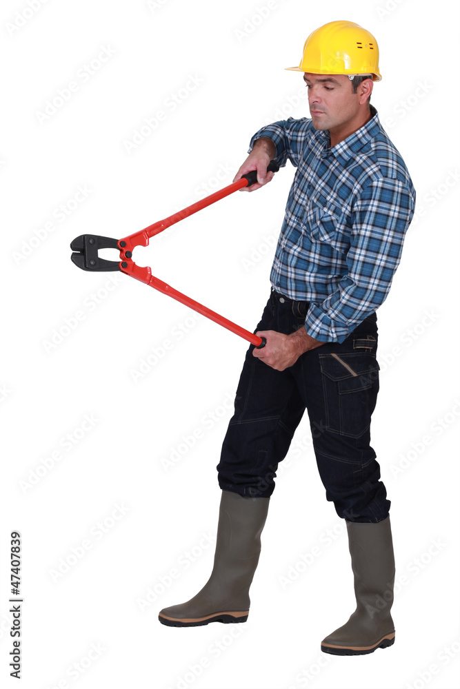 Labourer holding large clippers Labourer holding large clippers