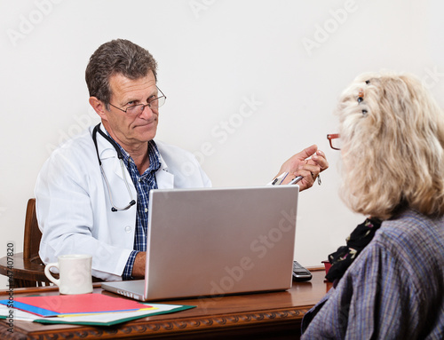Photography Unsympathetic Doctor Listening to Female Patient in Office