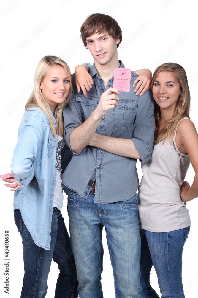 Fototapeta premium young man showing his driving license