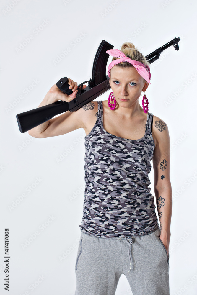 Young woman with automatic rifle Young woman with automatic rifle
