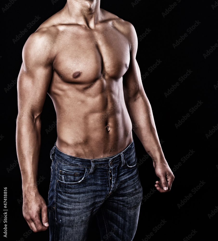 Portrait of handsome man posing on black background