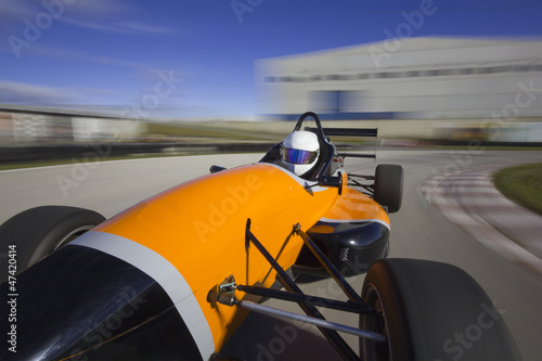 bolide driving at high speed in circuit.Camera on board view bac
