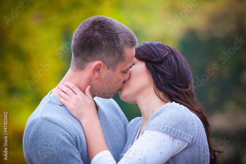 Portrait of couple enjoying golden autumn fall season