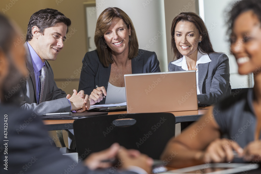 Business Team Using Laptop Computer in Meeting Business Team Using Laptop Computer in Meeting