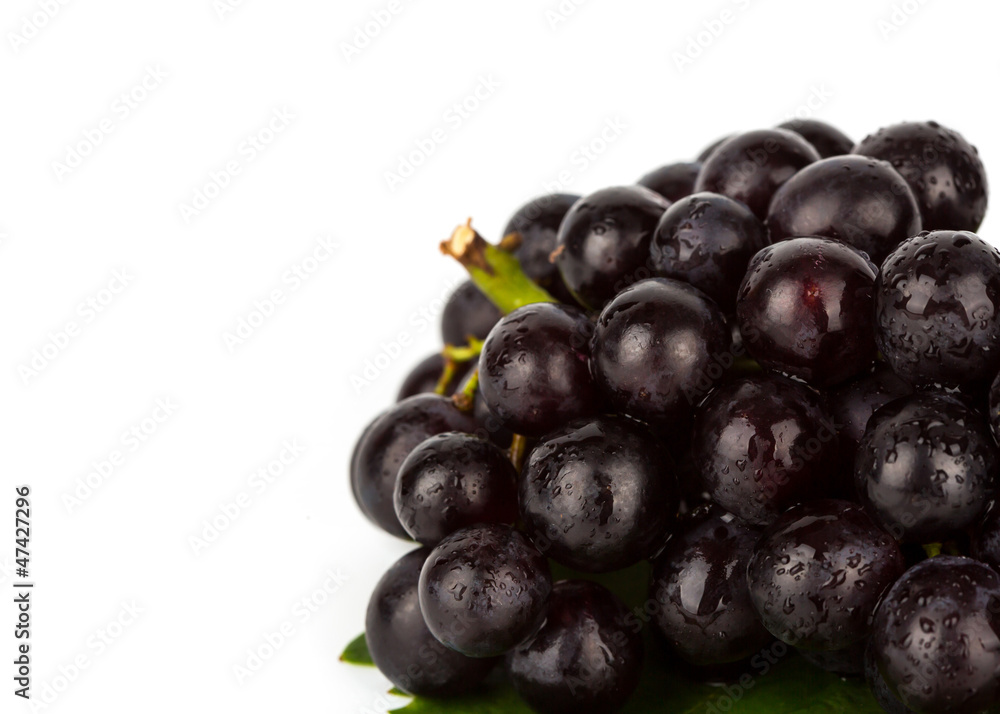 Red grape with green leaf isolated on white background Red grape with green leaf isolated on white background