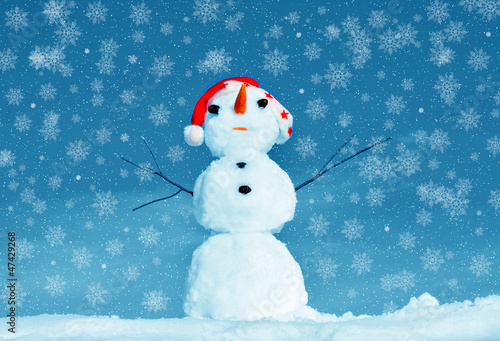 Snow man in santa cap on nature © elen_studio