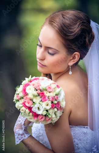 shot of a beautiful caucasian bride outdoor