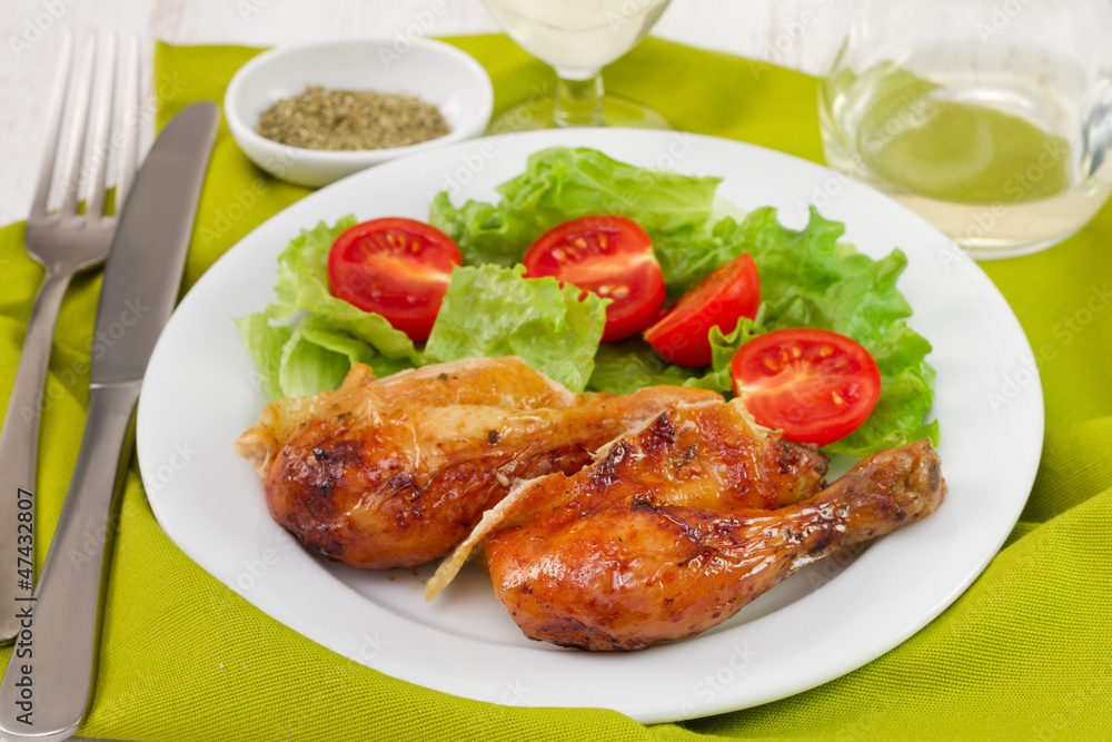 fried chicken with salad on the white plate