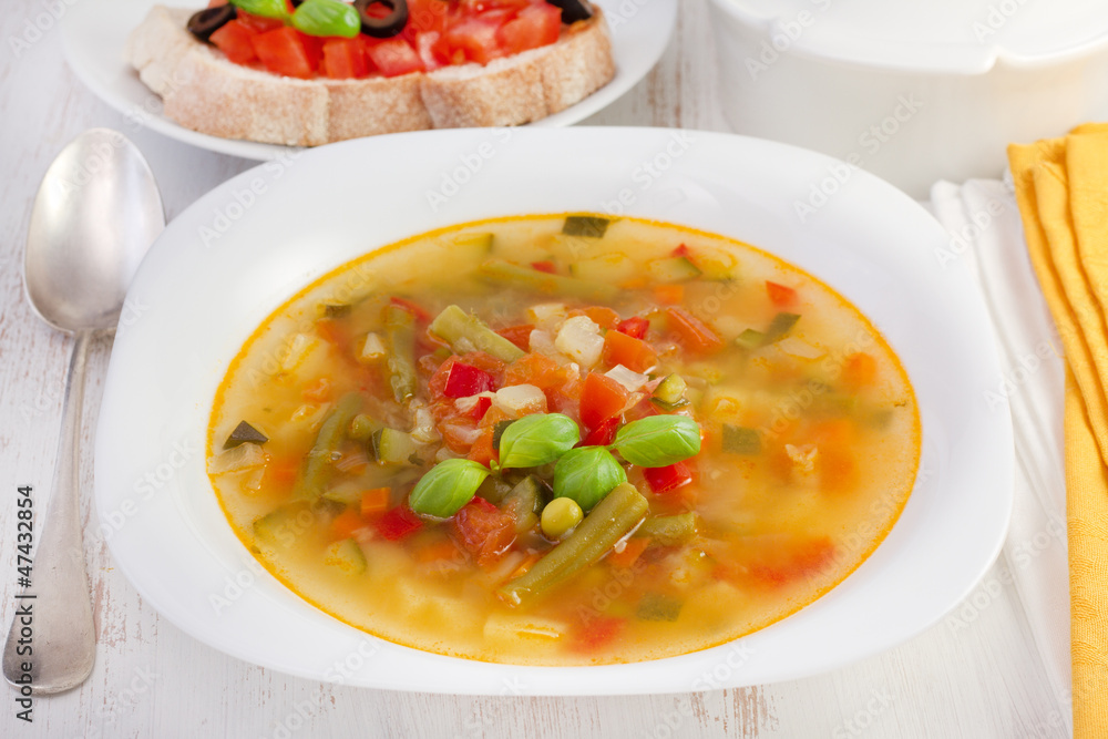 vegetable soup with basil on the plate