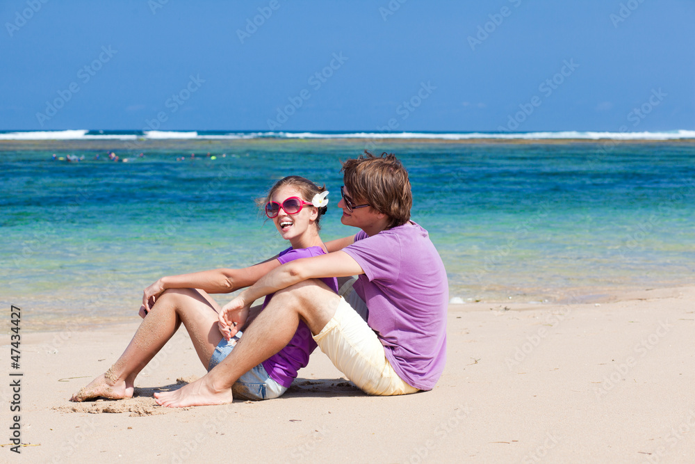 young beautiful couple on tropical bali beach.honeymoon young beautiful couple on tropical bali beach.honeymoon