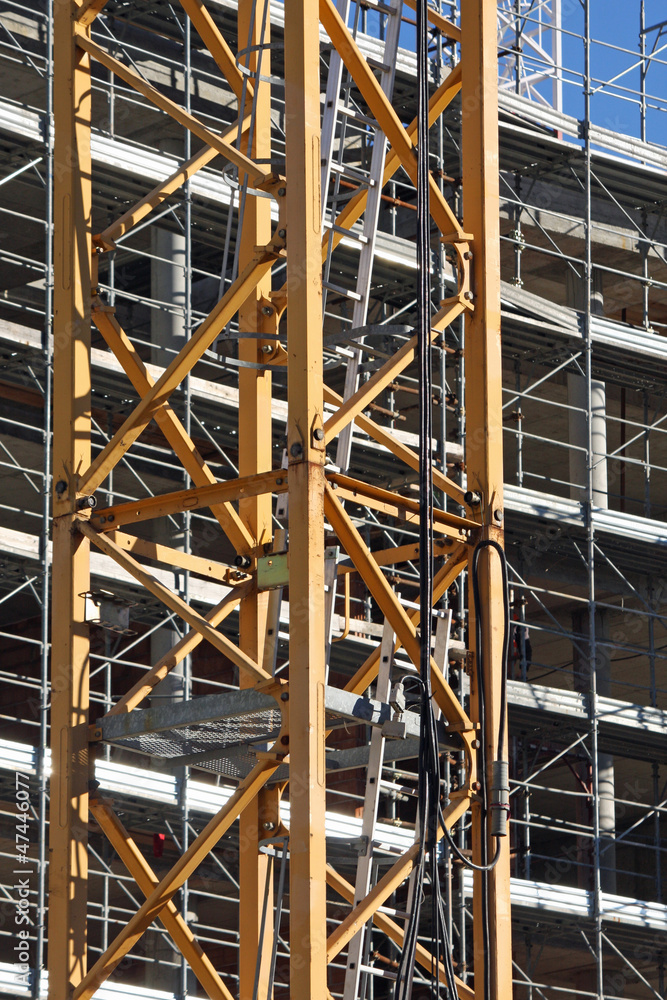 cranes and scaffolding on a construction site