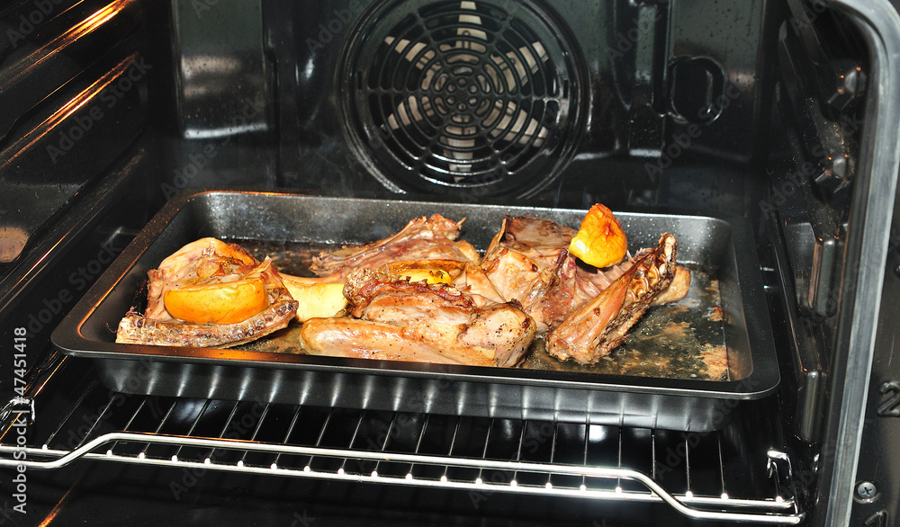 Roasted duck in oven.