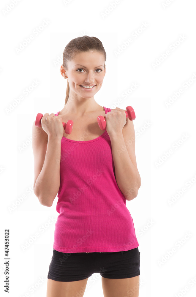 Fit girl with dumbbells smiling and looking at camera Fit girl with dumbbells smiling and looking at camera