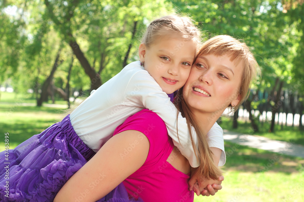 mother and daughter in the park mother and daughter in the park