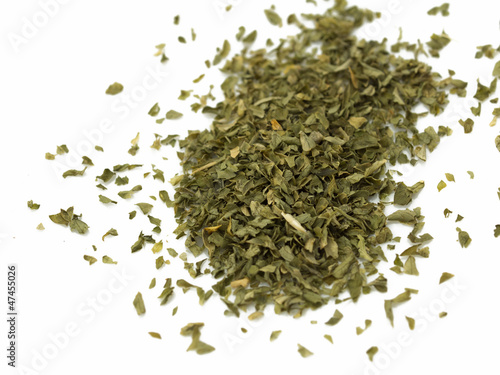 Spice of dried parsley isolated on white background