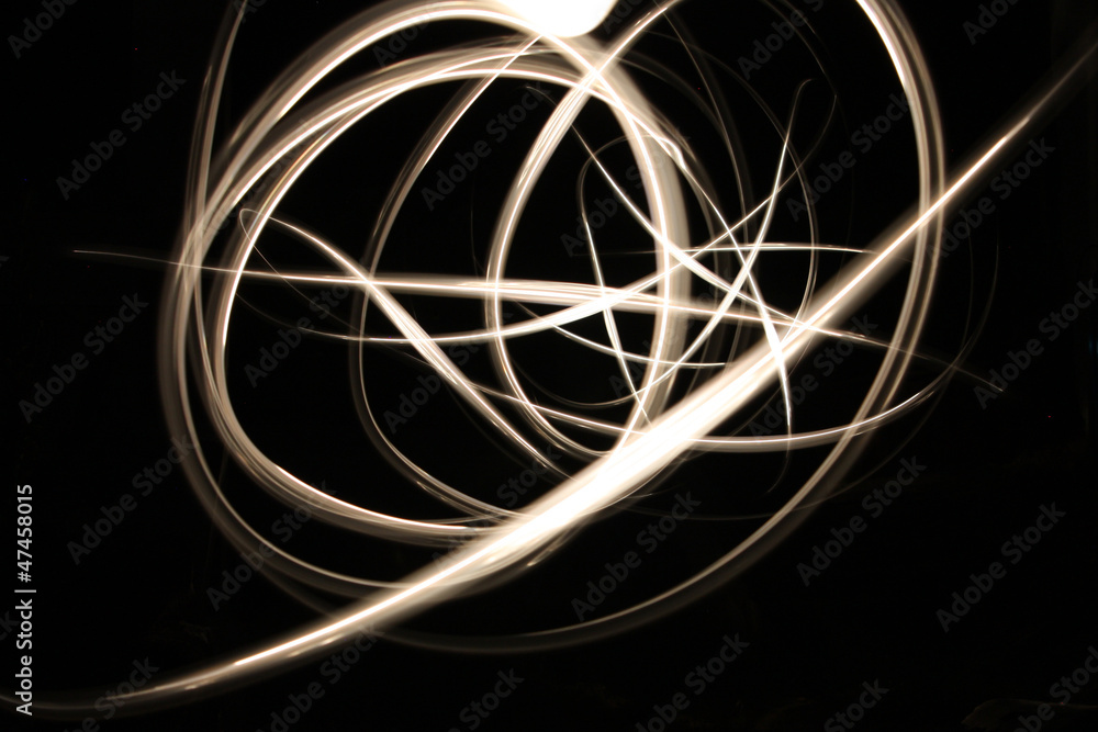Abstract glowing neon light curves in gold Abstract glowing neon light curves in gold