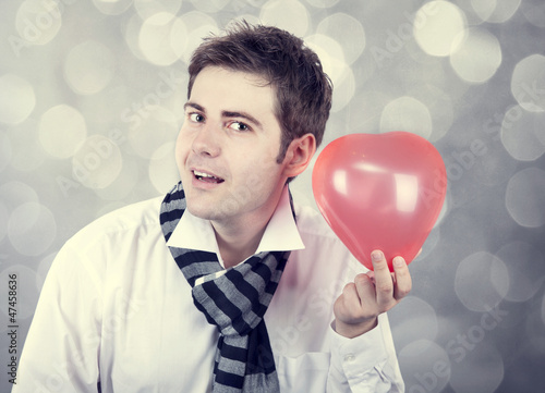 Beautiful men with heart balloon. St. Valentine © Masson