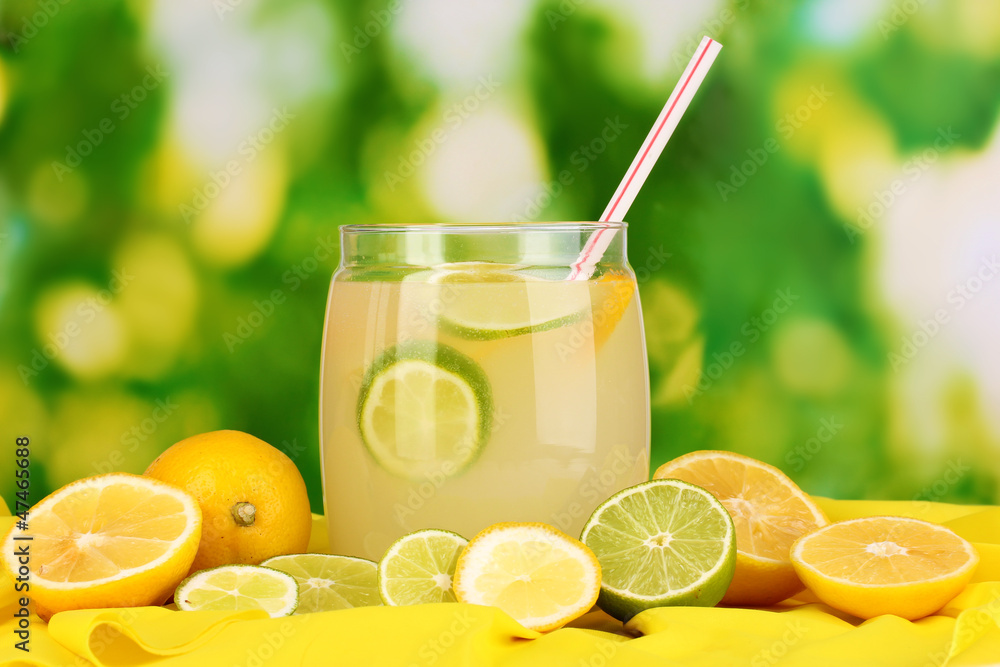 Citrus lemonade in glass bank of citrus around Citrus lemonade in glass bank of citrus around
