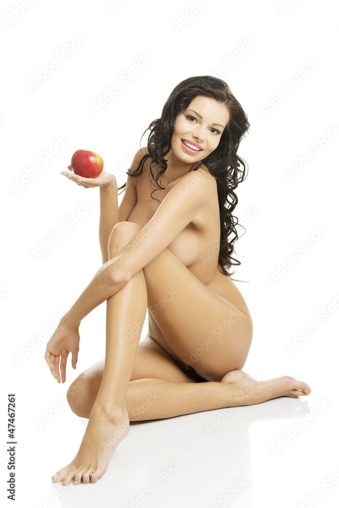 Fototapeta premium Happy fit nude woman with apple