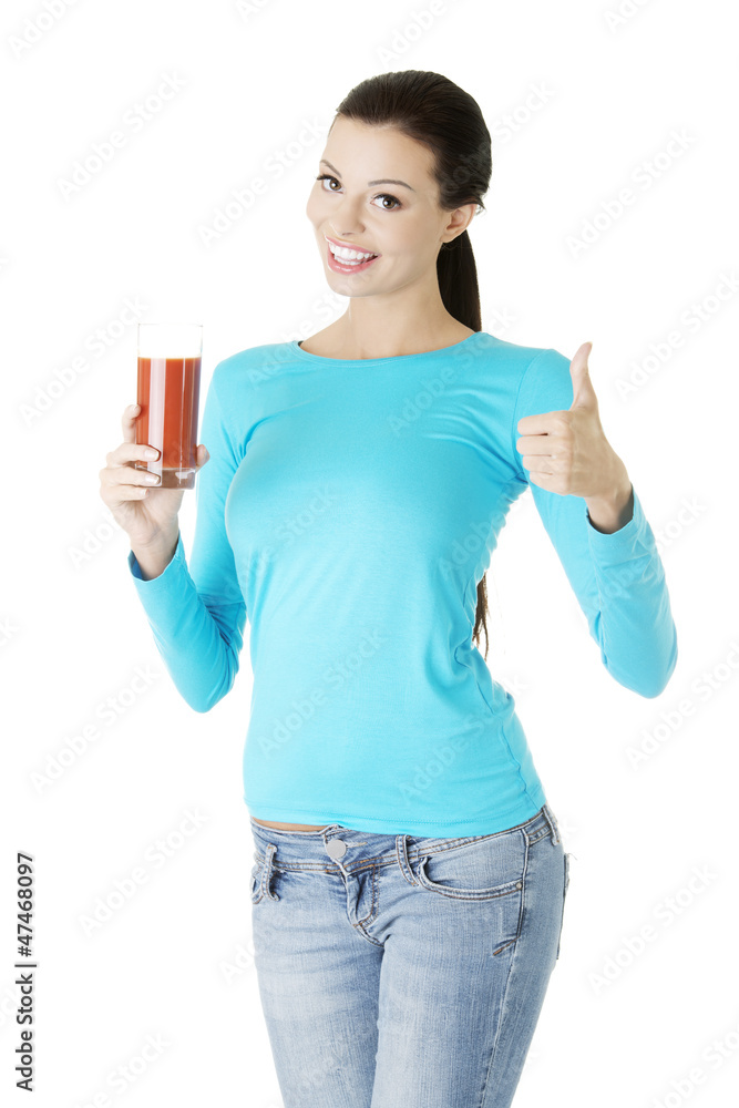 Happy smiling woman drinking tomato juice Happy smiling woman drinking tomato juice