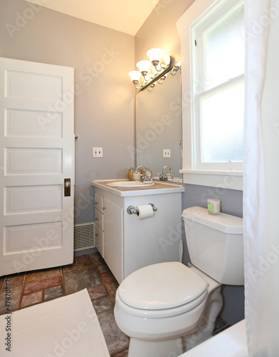 GREY and white small bathroom.