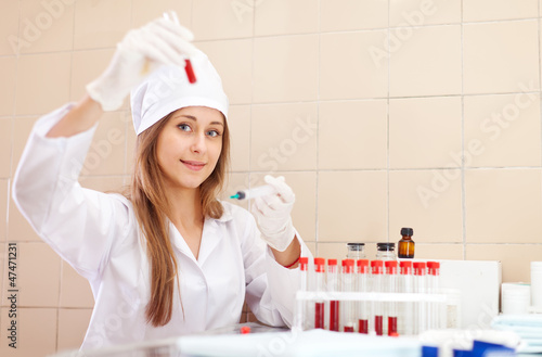  nurse works with blood sample photo