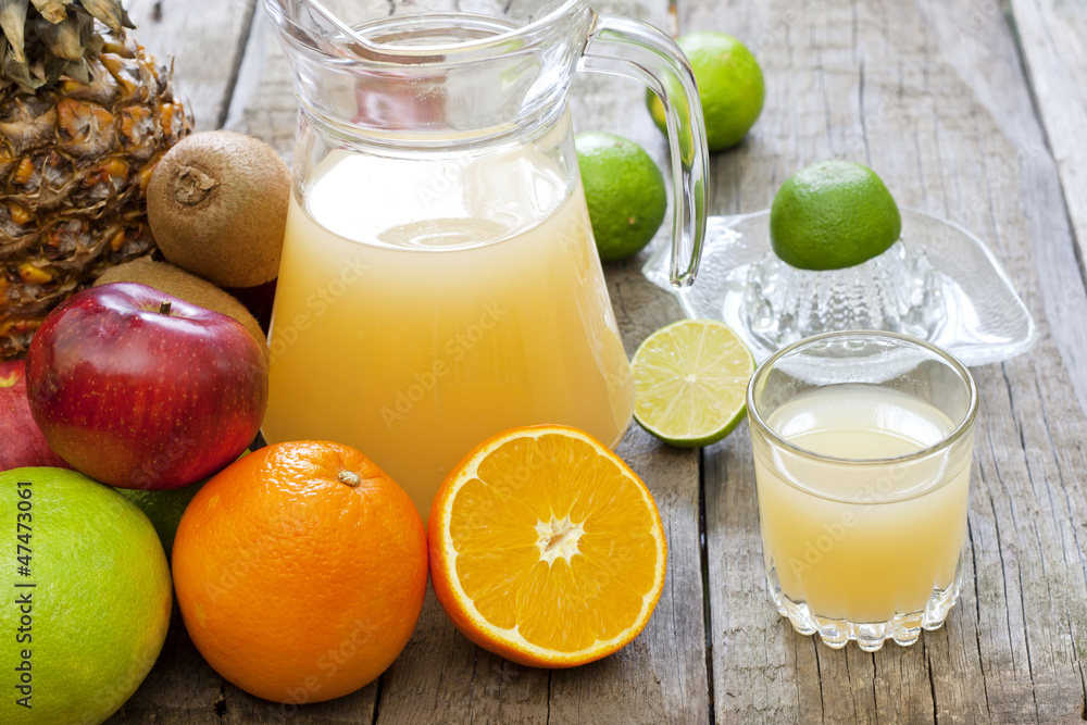 Fresh fruits juice with squeezer mixed assortment Fresh fruits juice with squeezer mixed assortment
