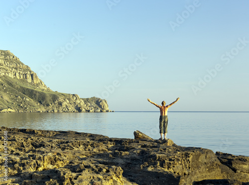 man on the seashore meditates