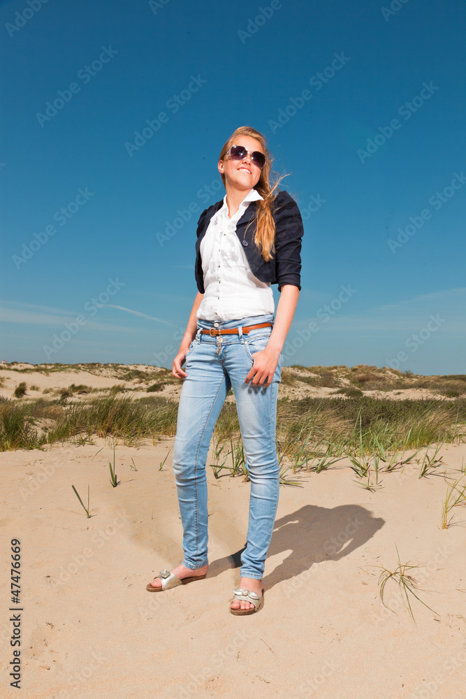 Pretty summer fashion girl on the beach with blue sky. Pretty summer fashion girl on the beach with blue sky.