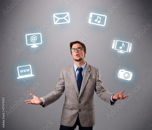 funny boy juggling with electronic devices icons