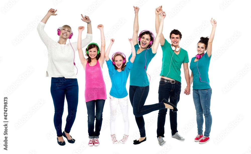 Group of music lovers dancing with their headphones on Group of music lovers dancing with their headphones on
