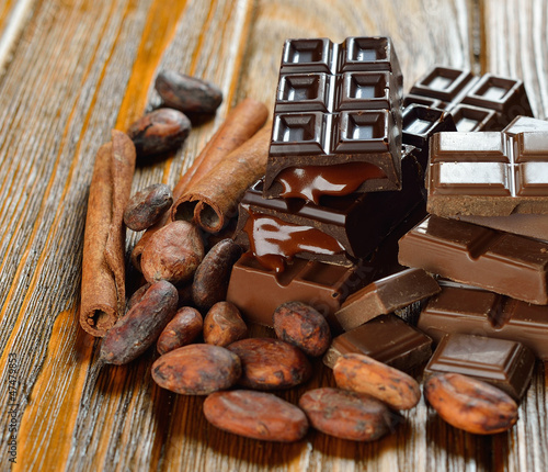 Chocolate and cocoa beans on a brown table