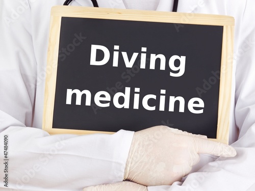 Doctor shows information: diving medicine photo