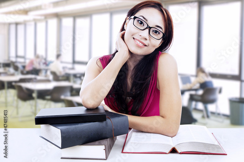 Free Download Beautiful student study at library - GFXLoad