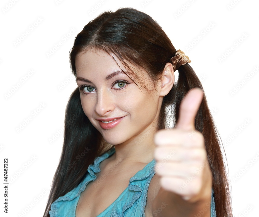 Woman showing thumb up with happy smile isolated on white backgr Woman showing thumb up with happy smile isolated on white backgr