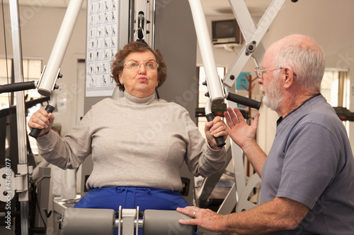 Senior Adult Couple Working...
