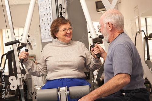 Senior Adult Couple Working...