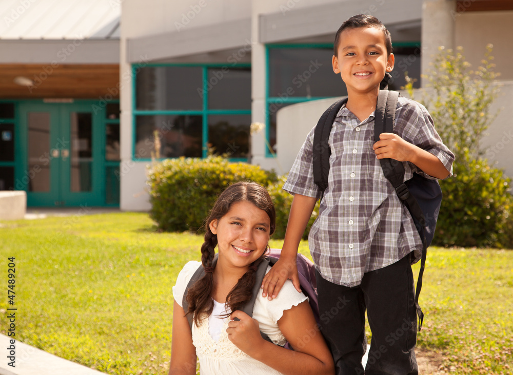 Fototapeta premium Cute Hispanic Brother and Sister Ready for School