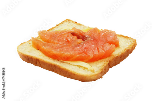 Sandwich with salmon and butter, isolated on white background.
