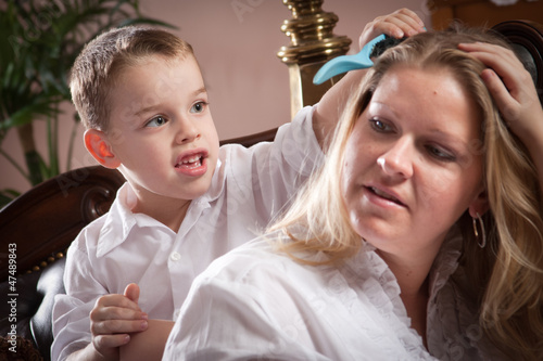 Cute Son Brushing His Mom's...