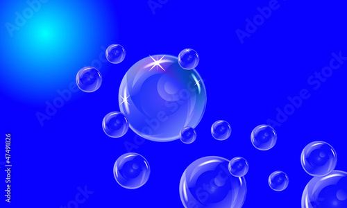Bolle e bollicine con lo sfondo blu