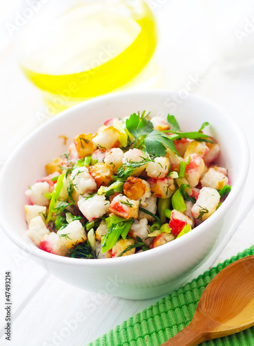 Fresh salad with greens and seafood