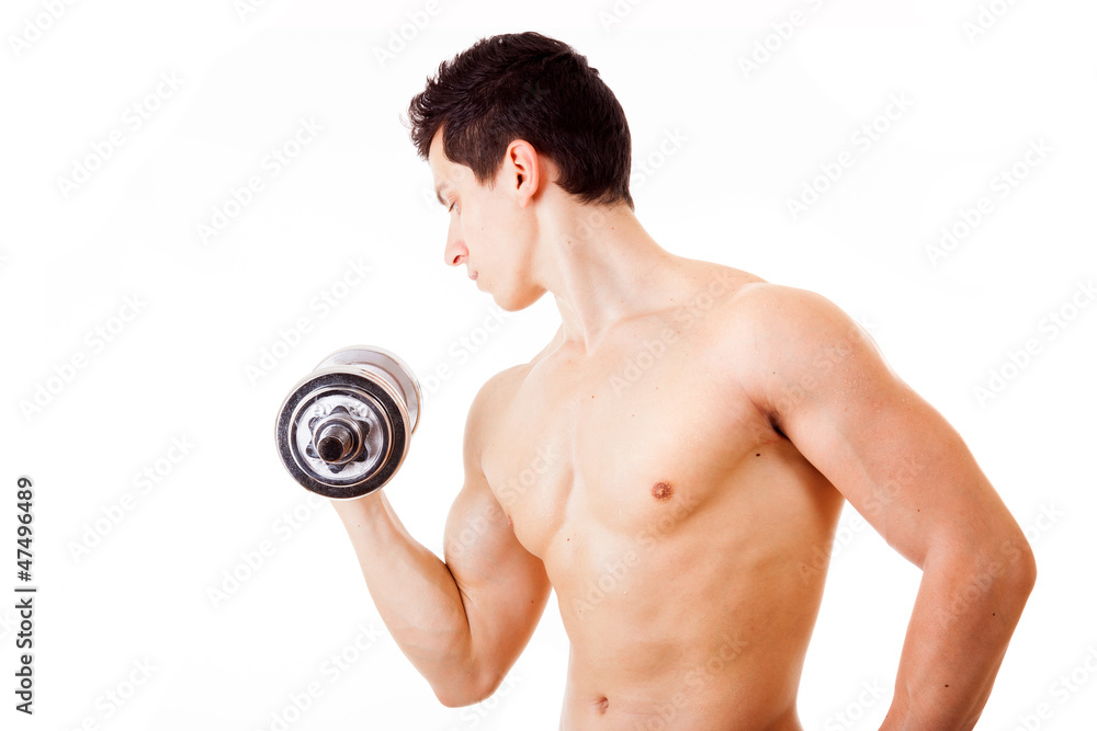 Fit muscular man lilifting weights and training his biceps, isol