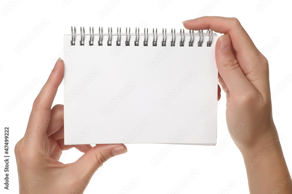 Obraz premium Hands holding notebook