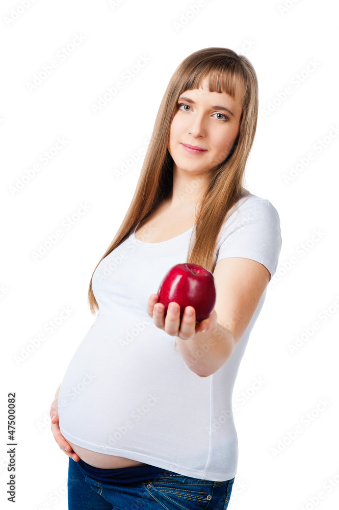 Beautiful pregnant woman holding a red apple Beautiful pregnant woman holding a red apple