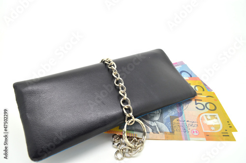 black leather wallet with lock and some banknote